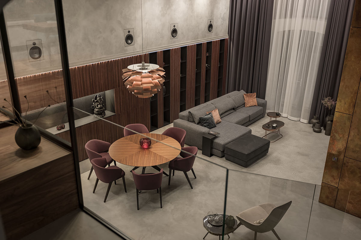 Living room with microcement on walls and floor viewed from above.