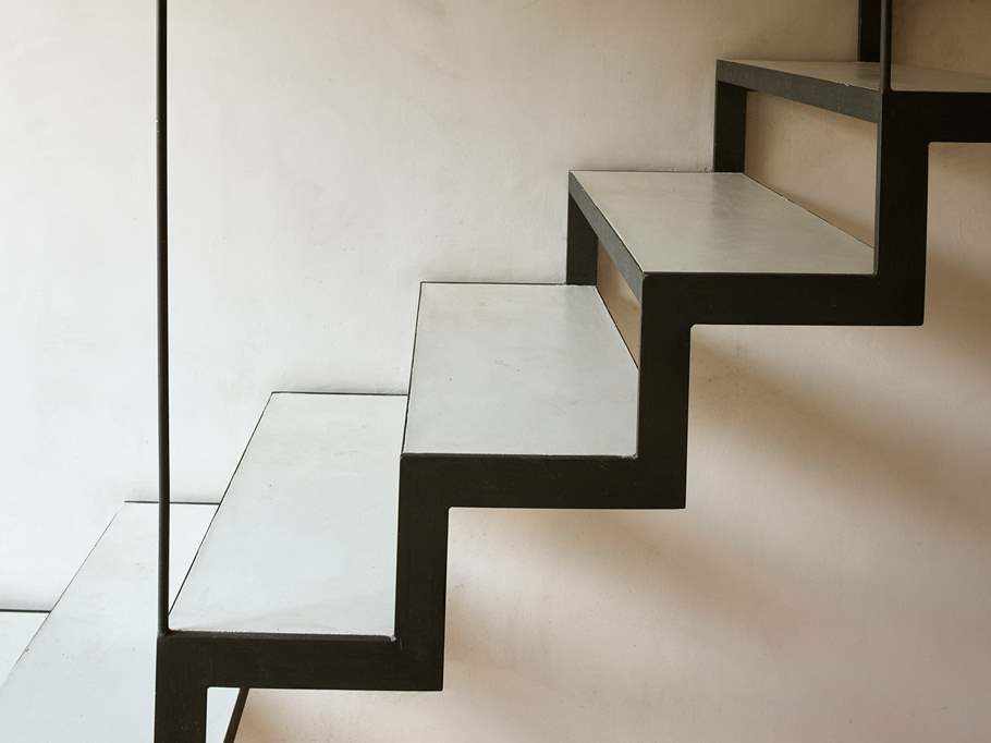 Microcement on wall and stairs at Casa Isabel.
