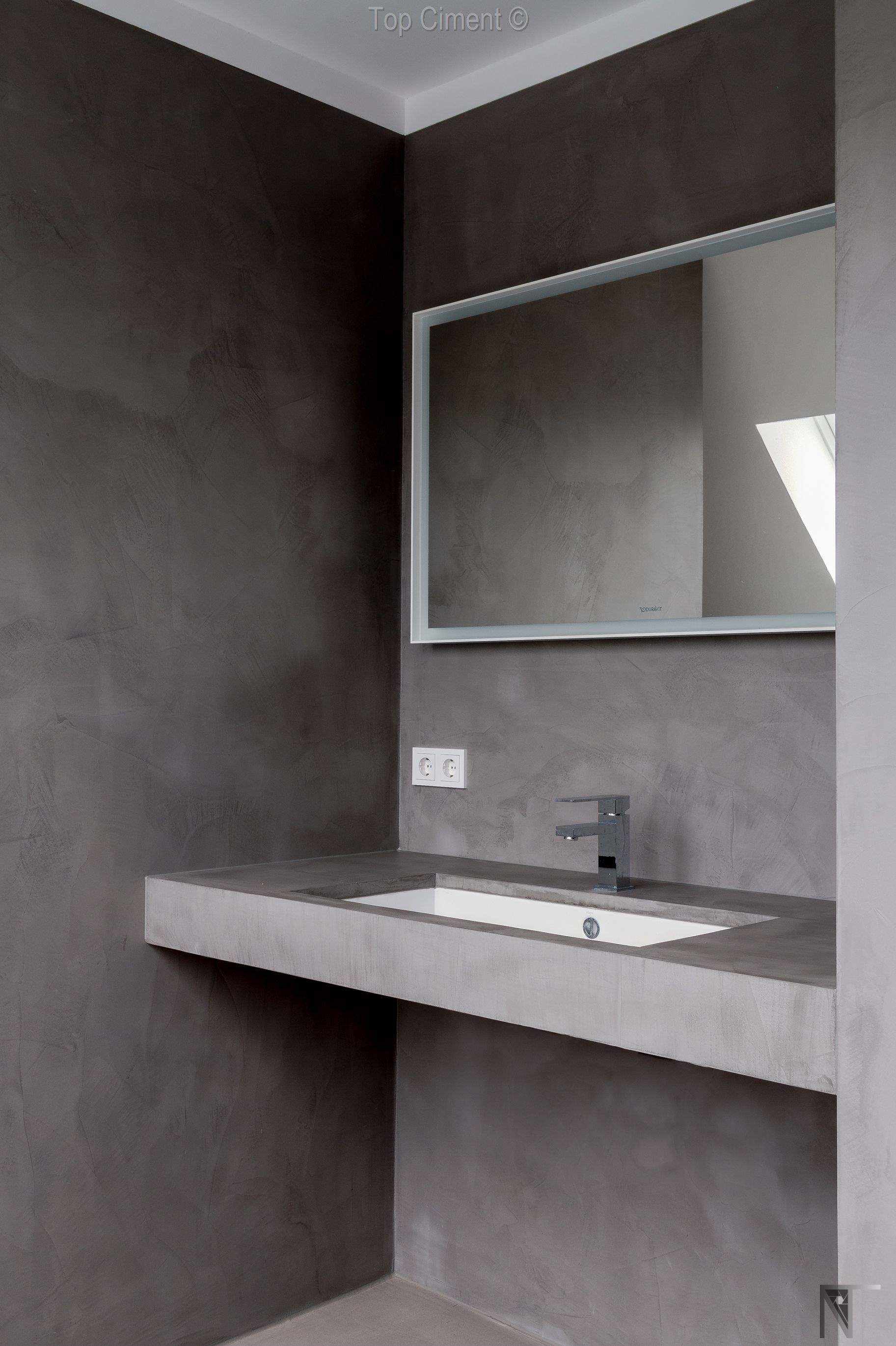 Tiled bathroom renovated with microcement on the countertop