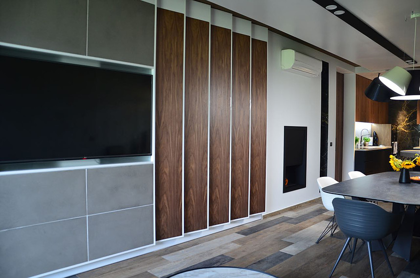 Grey microcement on wall panels in the living room.