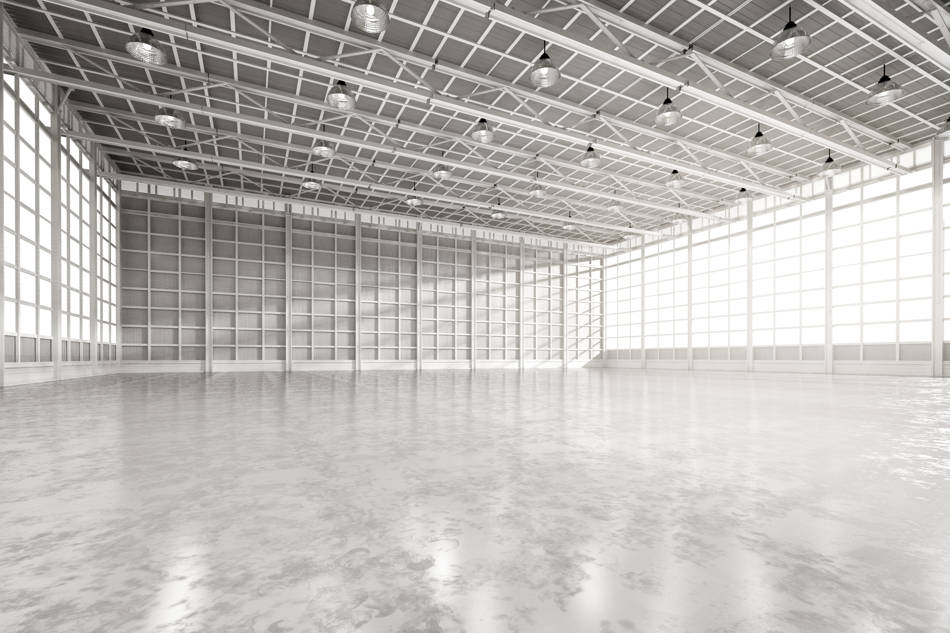 Bright industrial warehouse with polished flooring.