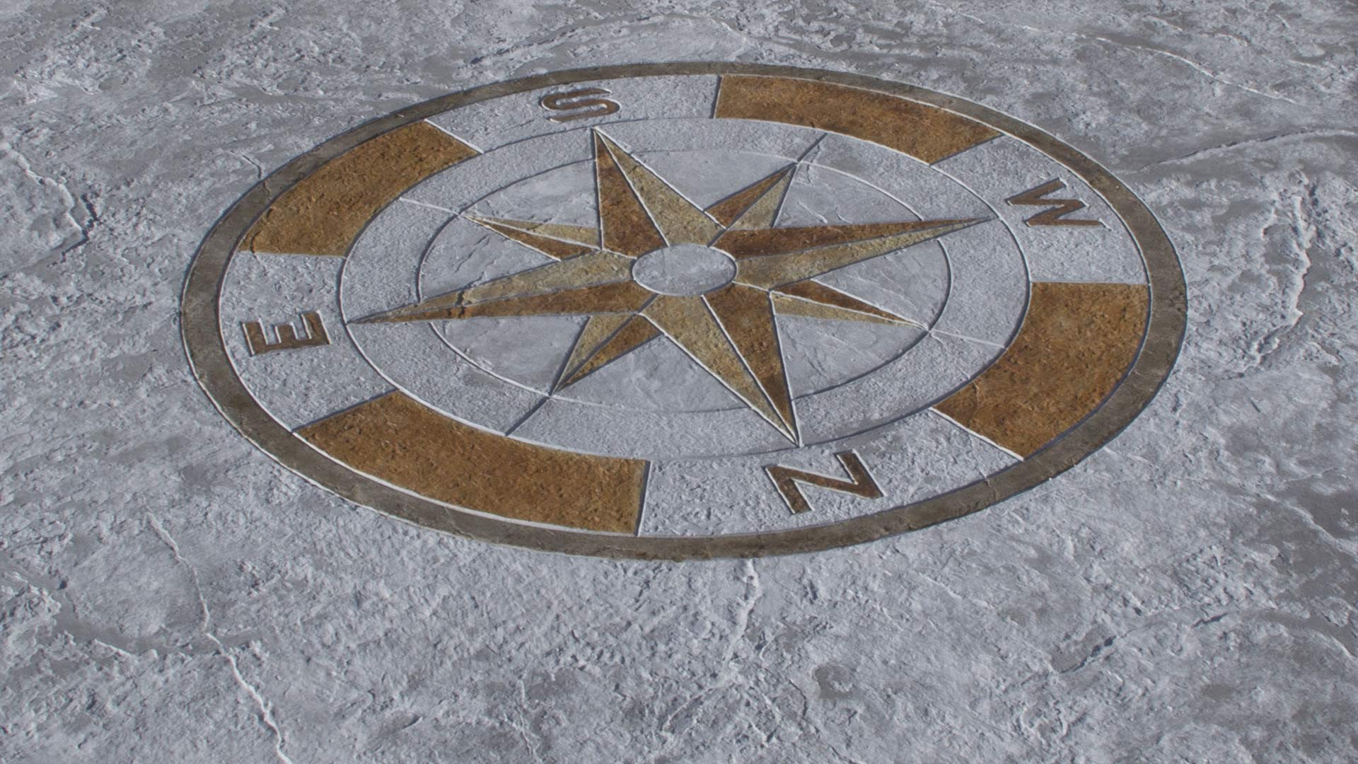 imprinted pavement with white and golden compass rose mold