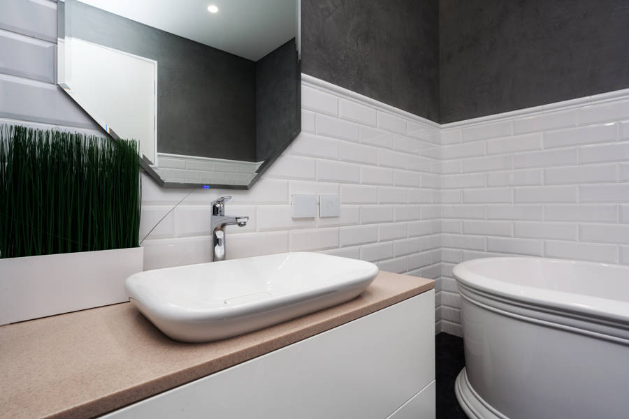 bathroom with tiles as wall cladding