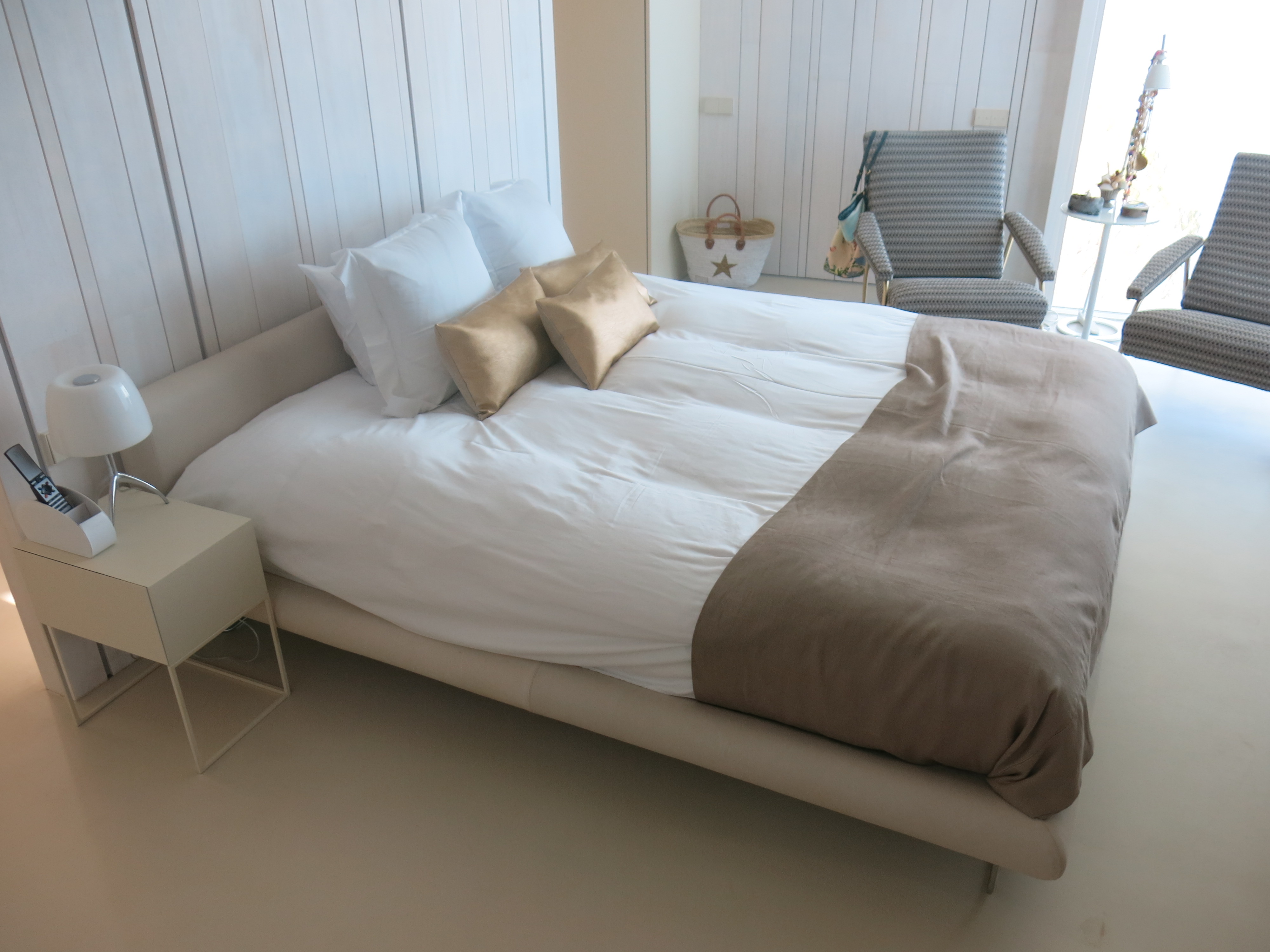Ivory microcement bedroom on radiant floor