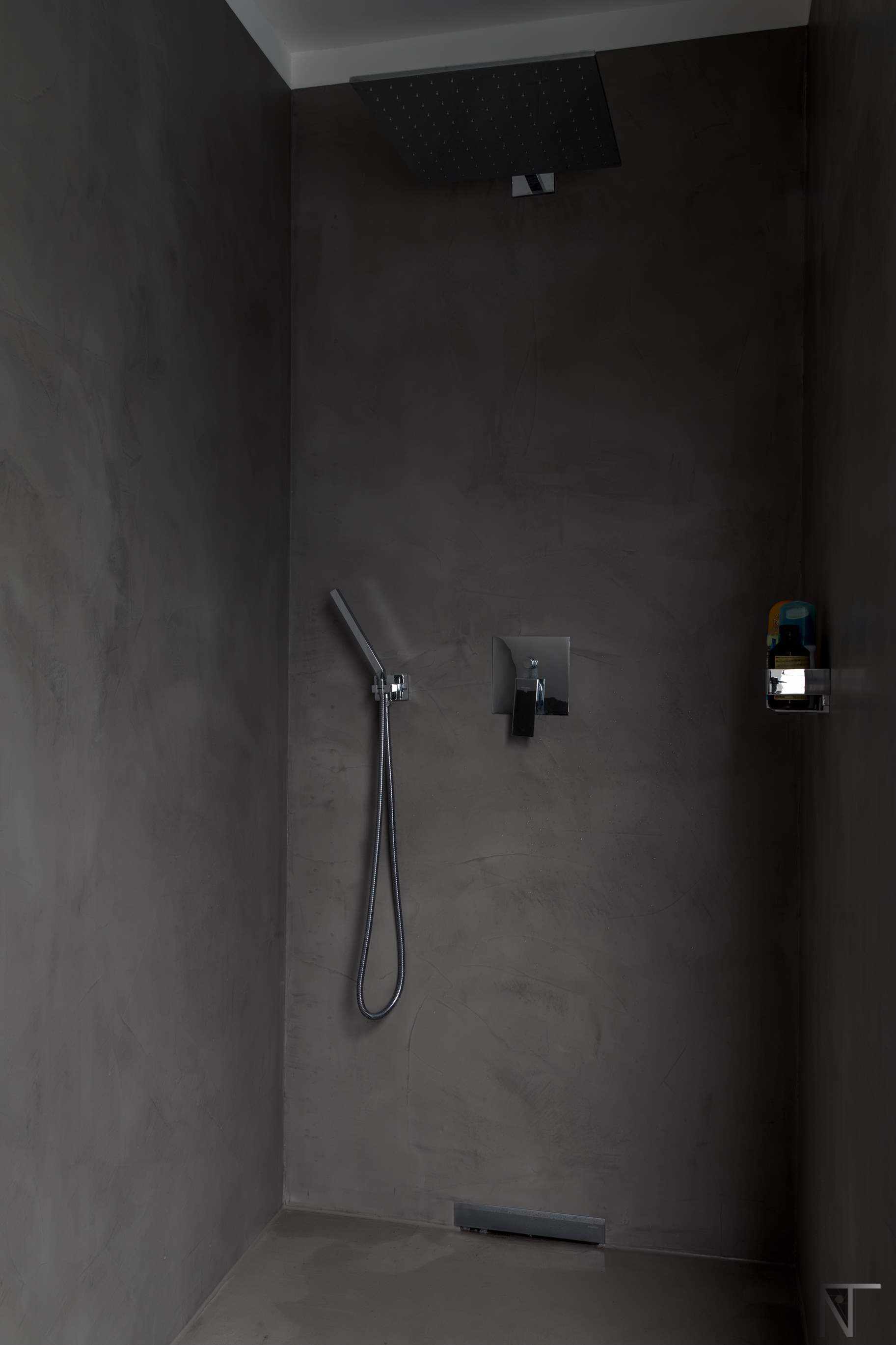 Tile bathroom renovated with microcement in the shower