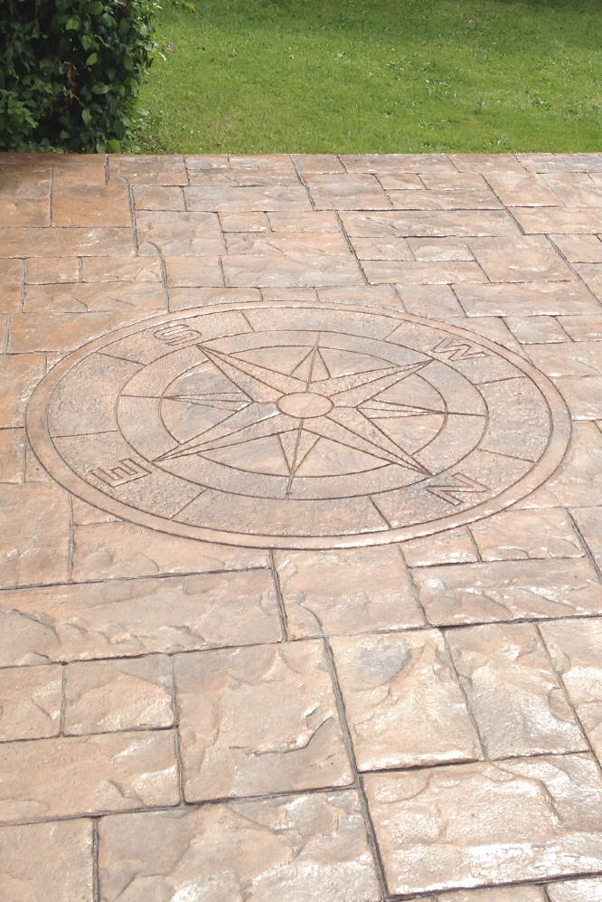 imprinted concrete floor with compass rose design