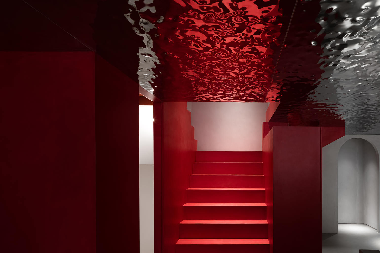 red microcement staircase in museum