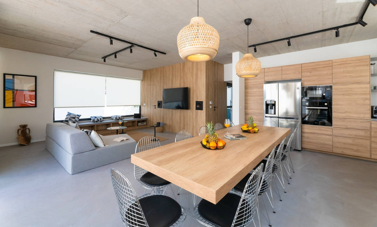 American kitchen with wooden furniture and decorated microcement flooring in Gold Coast. 