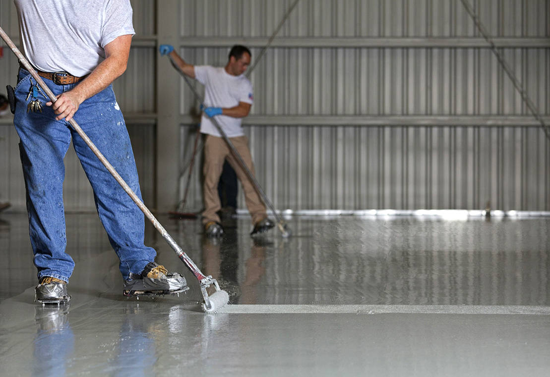Epoxy floor application in a warehouse Epoxy floor application in a warehouse