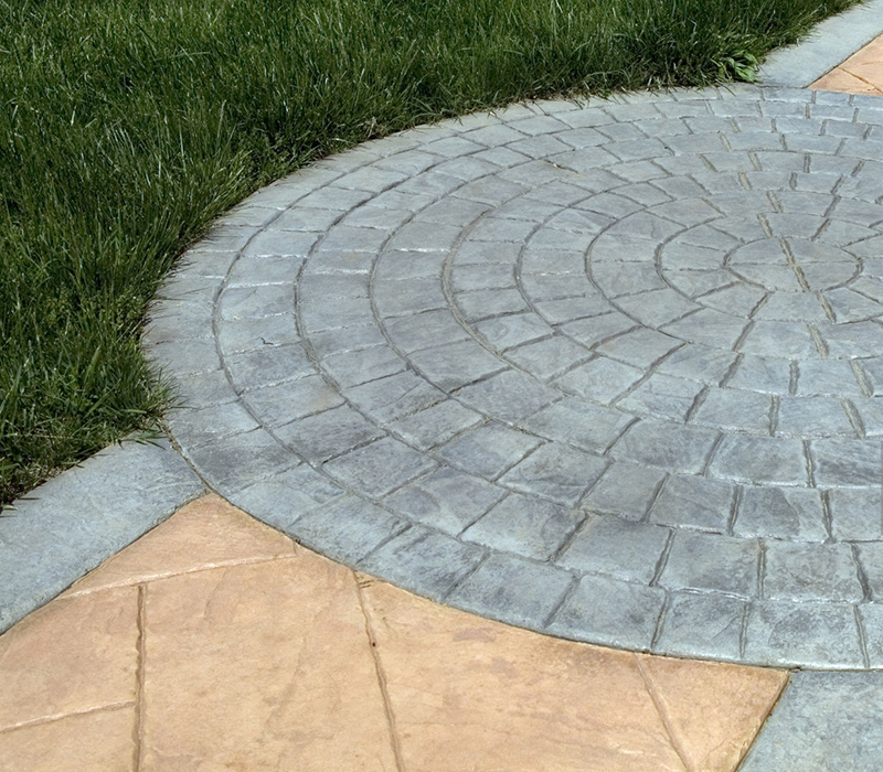  garden with cast stamped concrete in the ground