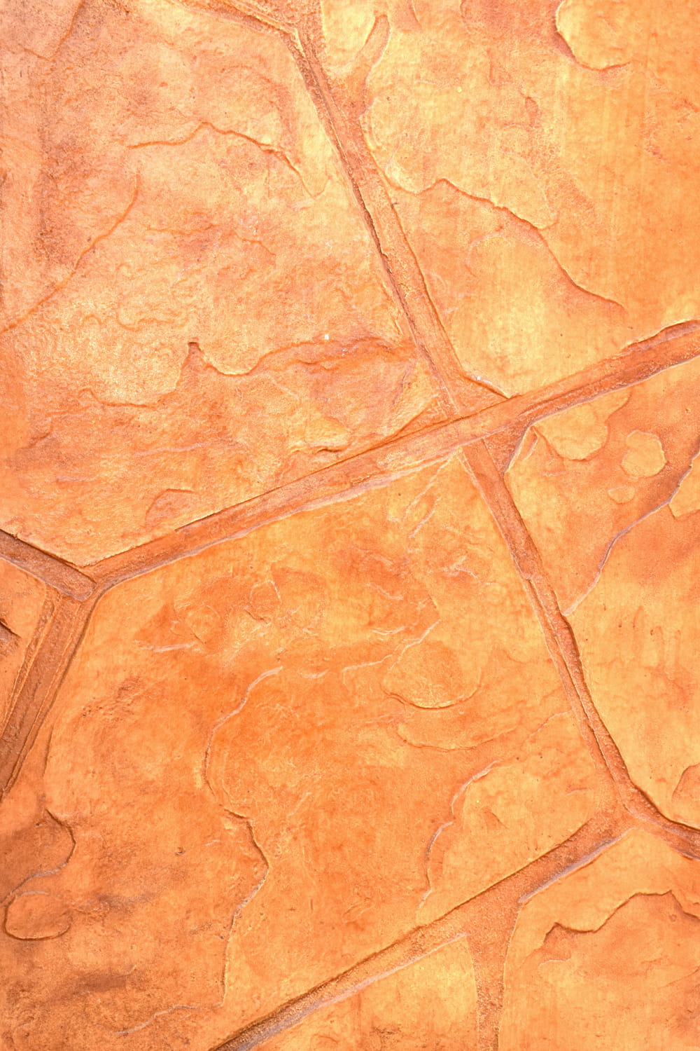 オレンジ色の石模様のインプリントコンクリート舗装