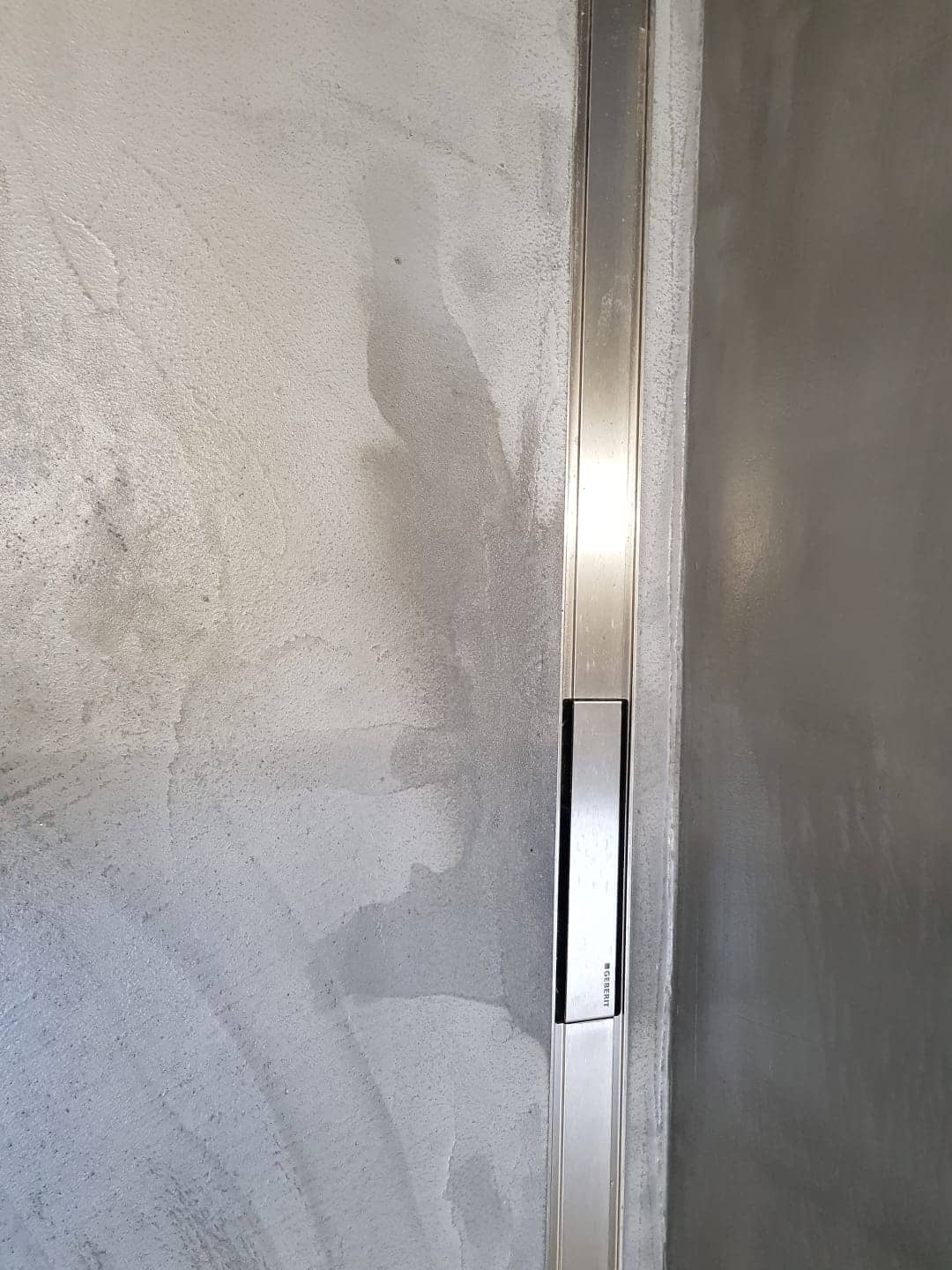   Microcement en vocht in een douche